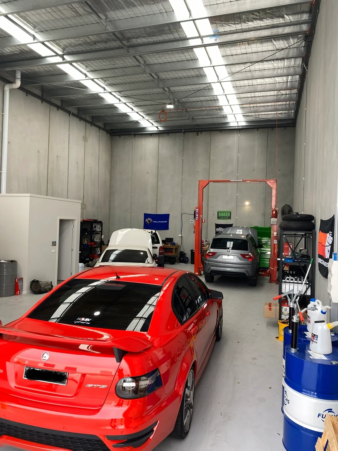 Workshop with multiple European cars in service bays