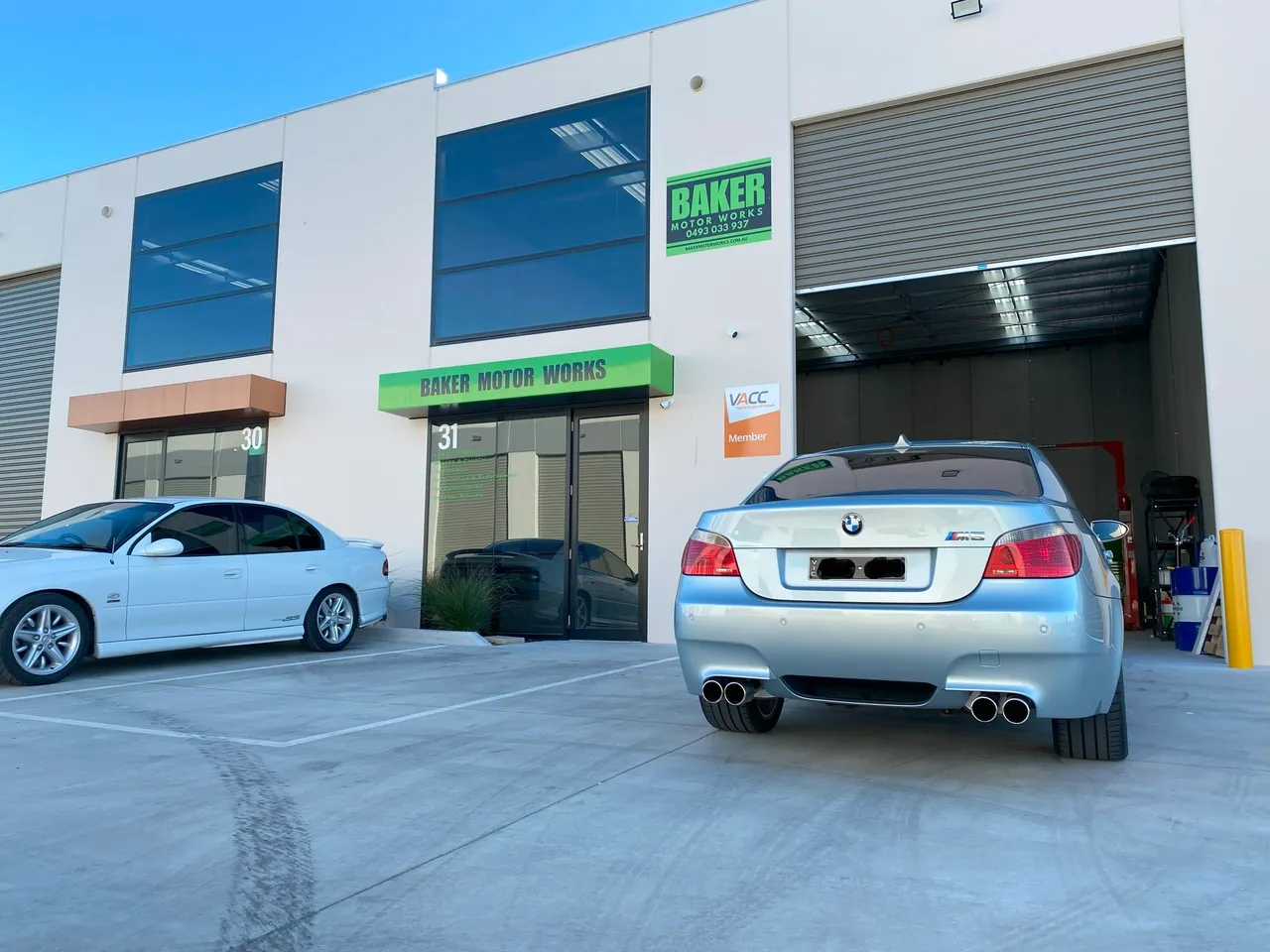 Baker Motor Works exterior with BMW performance vehicle